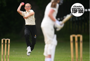 Queen's College Girl bowls in cricket match