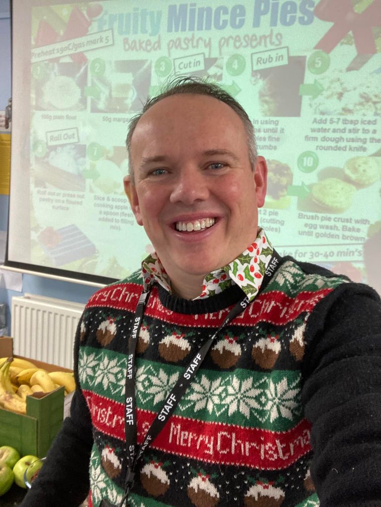teacher wearing christmas jumper