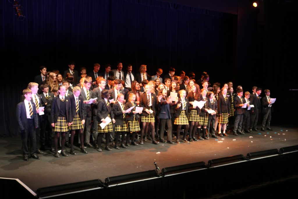 Students singing on the stage