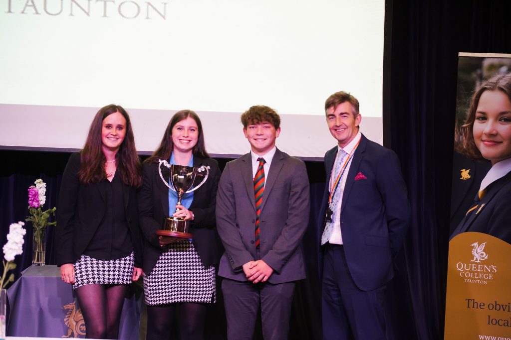 pupils holding a trophy