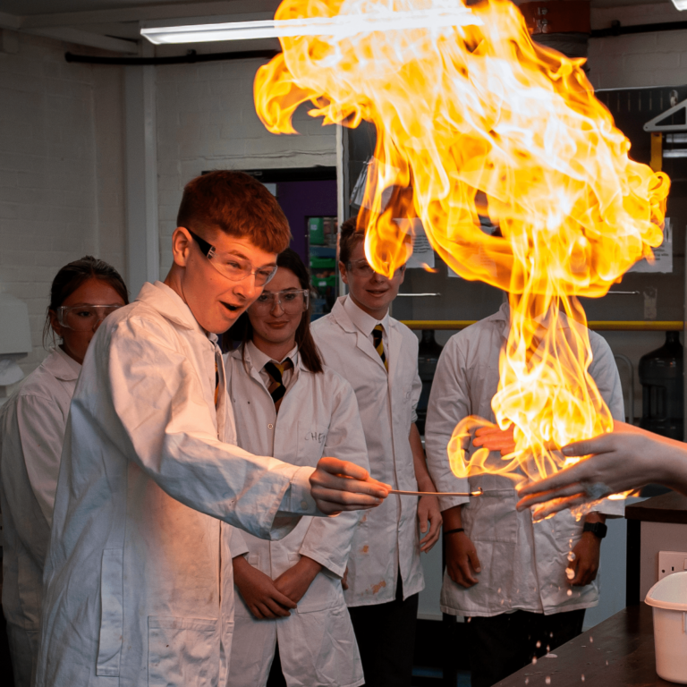 Queen's College pupil doing a Chemistry experiment
