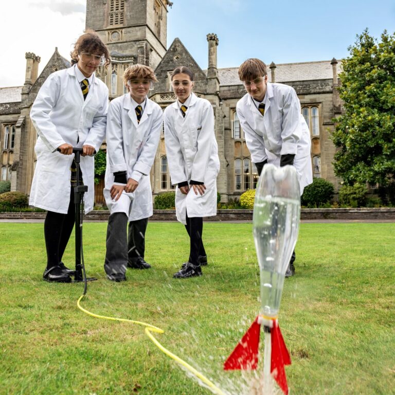 Queen's College pupils doing a Science experiment