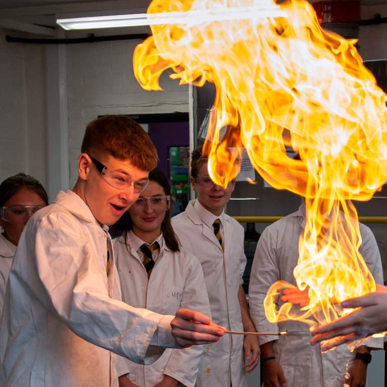 Queen's College pupil doing a Chemistry experiment