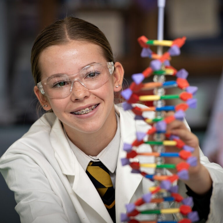 Queen's College pupil in a science lesson