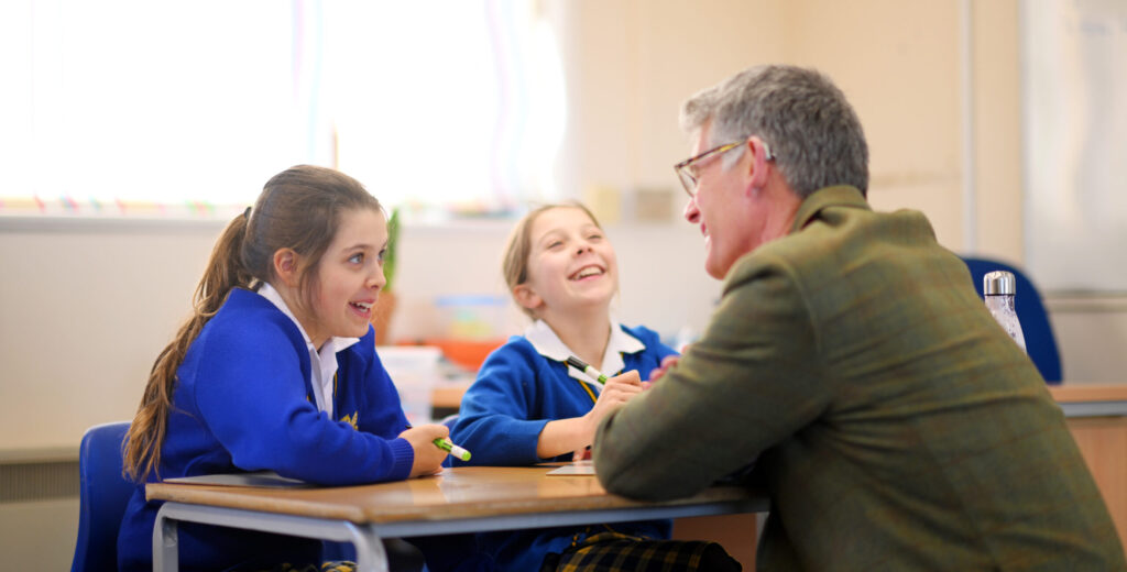 Queen's College prep pupils with a teacher