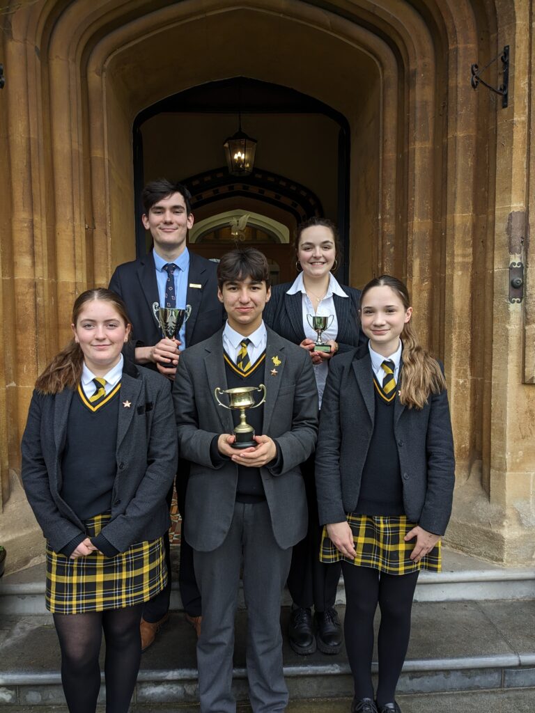 students with trophies