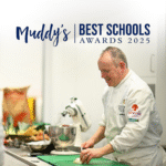 Teacher leading a cooking class with 'Muddy's Best Schools Awards 2025' logo.