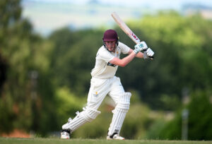 A Pupil playing cricket.
