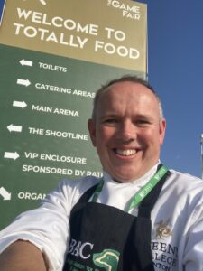 Joe Mann standing proudly outside The Game Fair. 