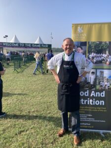 Joe Mann standing proudly outside the Game Fair