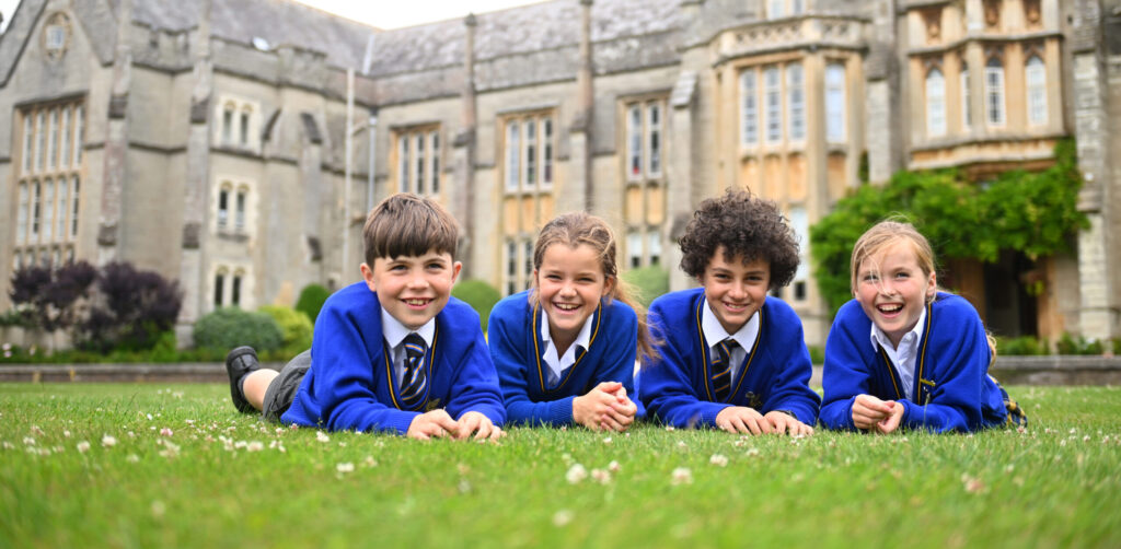 Queen's College Prep pupils gathered on the front lawn
