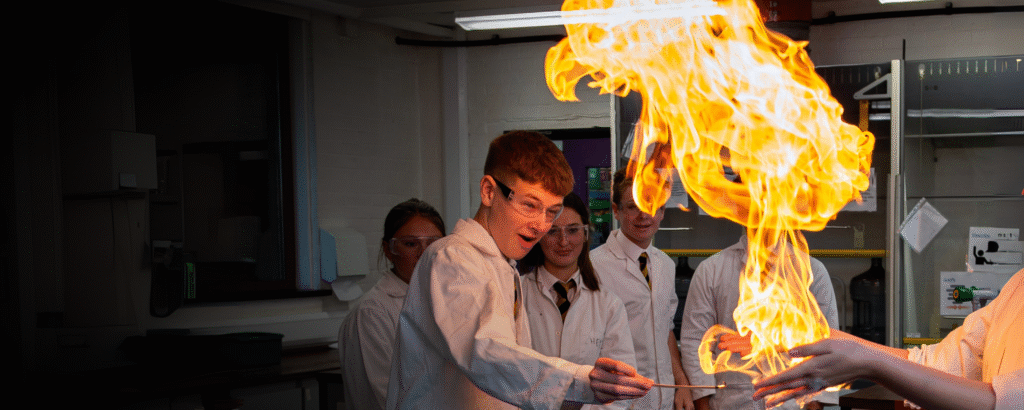 Queen's College Pupil doing a chemistry experiment