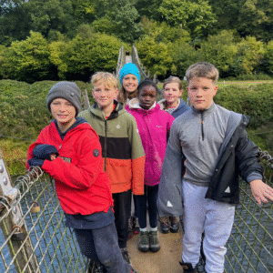 Pupils standing on a bridge about to begin a hike.
