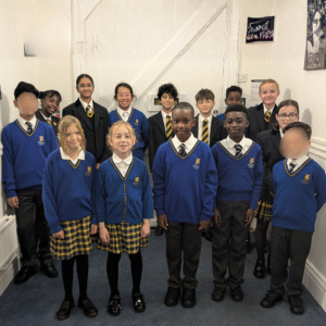 Cotlake boarders standing near the door of the house.