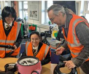 pupils assembling henry vacuums. 
