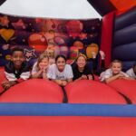 Boarders on a bouncy castle.