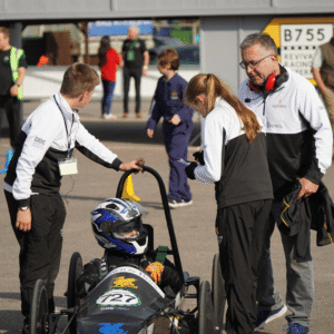 Pupils working on the car before the race.