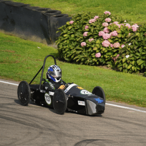 The race car on the track at Goodwood.