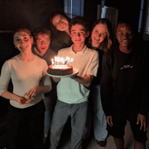 Pupils holding a birthday cake.
